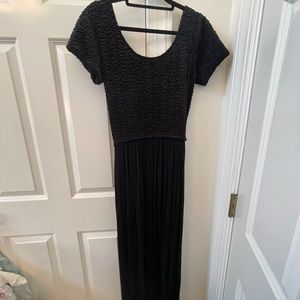 Vintage long black dress with short sleeves. Size small.